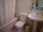 The upstairs house has a family bathroom as well as an additional guest toilet.
